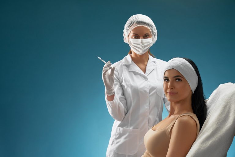 Cosmetologist with syringe and patient on chair